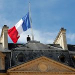 a-republican-guard-pays-respects-after-lowering-the-french-national-flag-at-half-mast-at-the-elysee-palace-in-paris-france-the-day-after-the-bastille-day-truck-attack-in-nice.jpg