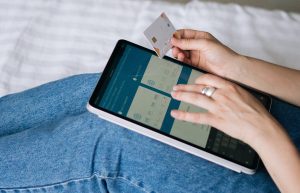Woman using tablet for online transfer of funds. | Photo by Tima Miroshnichenko from Pexels