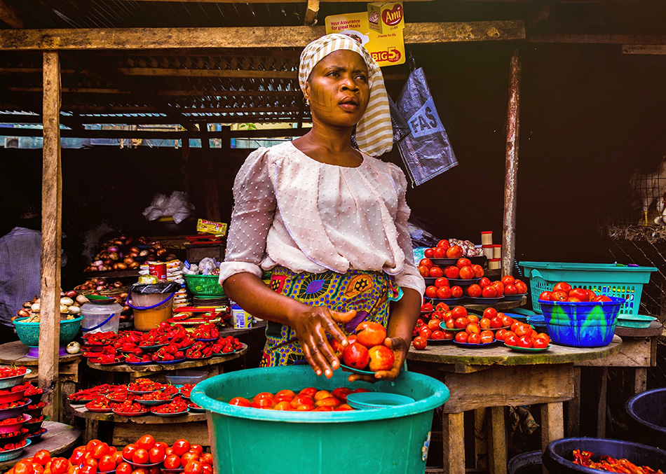 Photo for illustrative purposes only. Portrait of a woman selling tomatoes and peppers in Lagos, Nigeria. 3 December 2019. Photo by Omotayo Tajudeen/Unsplash