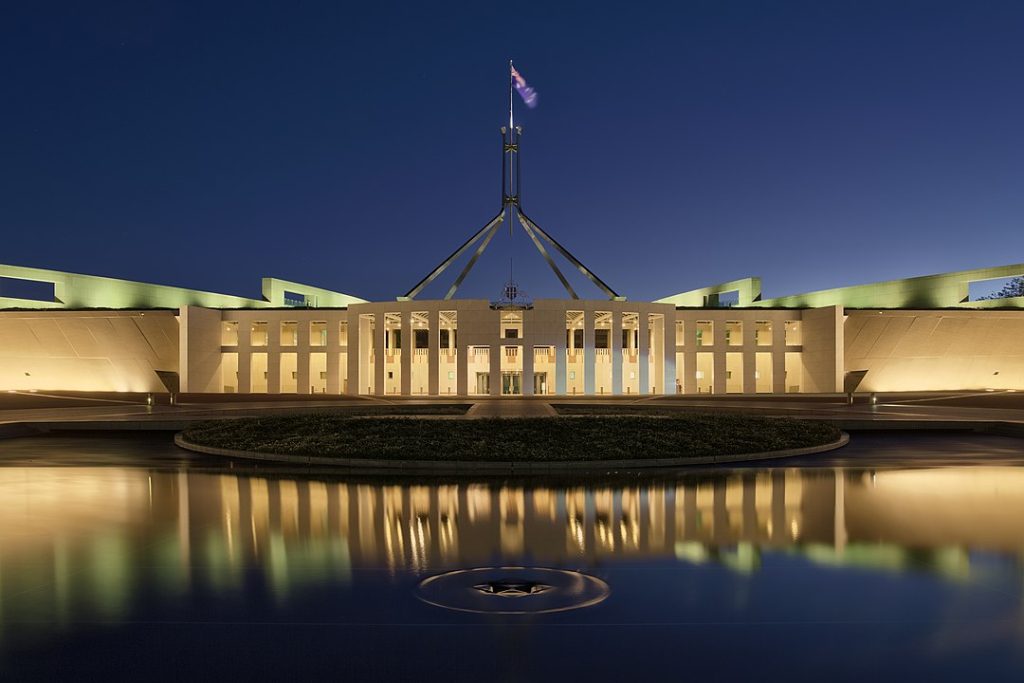 Blue hour photo of Parliament House, Canberra, Australia. This image is a HDR composite, stitched from four different exposures. 7 April 2017. | Photo by Thennicke - Own work, CC BY-SA 4.0, https://commons.wikimedia.org/w/index.php?curid=57886437