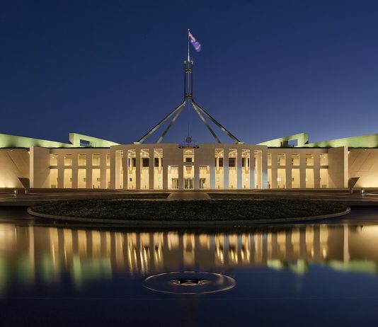 Blue hour photo of Parliament House, Canberra, Australia. This image is a HDR composite, stitched from four different exposures. 7 April 2017. | Photo by Thennicke - Own work, CC BY-SA 4.0, https://commons.wikimedia.org/w/index.php?curid=57886437