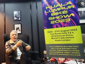Malaysia's menswear maestro, Bon Zainal, being interviewed by Lucas Catts for News Hub Asia (NHA) at the exclusive media event by the Kuala Lumpur Bike Show 2023 at his boutique in Plaza Damas, Hartamas, Kuala Lumpur. | Photo by Ruzanna Muhammad/NHA File Photo