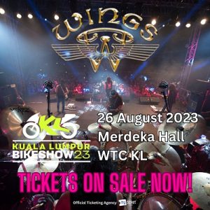 Malaysian rock band, Wings, concert. View from behind the drummer on stage facing the audience. | Poster by Kuala Lumpur Bike Show 2023/Moventuum