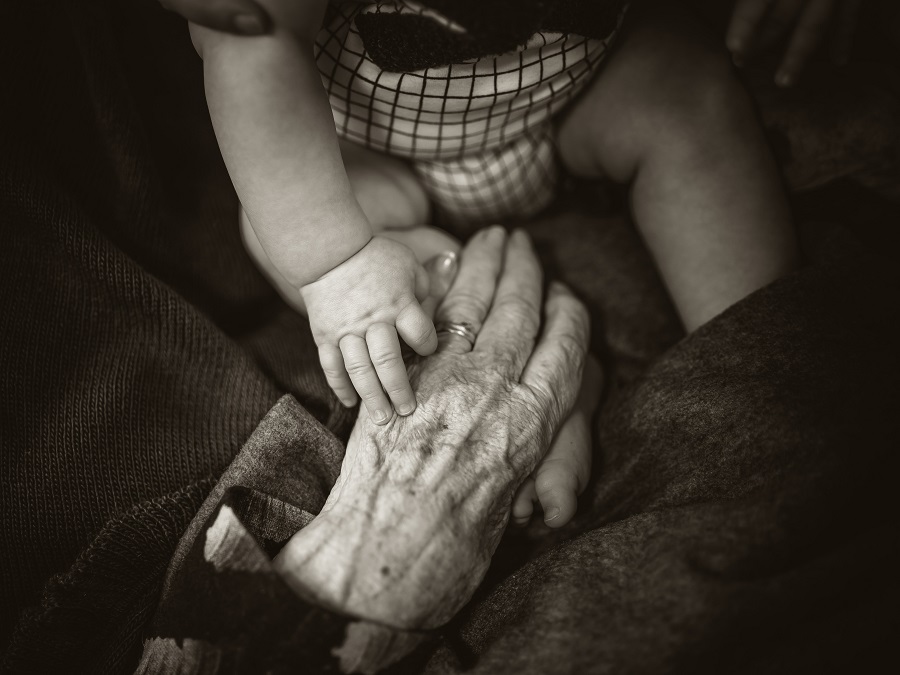I love this photo of my mums hand reaching out to share a moment with her great grandson. Even when we can’t understand each other in language, we can all understand what a simple touch means. | Photo by Rod Long/NHA File Photo