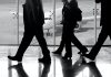 Silhouettes of business travellers walking in the airport by the window with an airplane in view in Valencia, Spain, 9 October 2020. | Photo by Rob Wilson/Unsplash/NHA File Photo