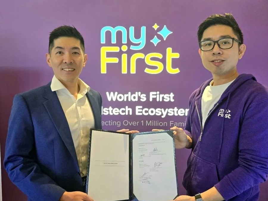 Fu Yu's Group CEO, David Seow, with myFirst's co-founder and CEO G-Jay Yong in front of myFirst's retail store at Suntec City, Singapore. 4 April 2024.
