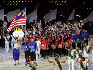 National karate champion R. Sharmendran bearing the Jalur Gemilang as the Malaysian contingent, clad in batik clothing as the official wear, participate in the opening ceremony of the 32nd SEA Games, at the Morodok Techo National Stadium in Phnom Penh, Cambodia, on 5 May 2023. | Photo by BERNAMA via Selangor Journal