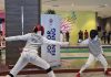 Saif Nordin (left) scoring a point at the 2nd Komtar JBCC Allez Johor 2024 fencing competition, which was held from 8 to 11 November 2024. Johor Bahru, Johor, Malaysia. | Photo by News Hub Asia