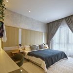 Designed with relaxation in mind, the master bedroom combines natural tones and soft textures to create a serene