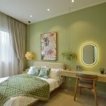 Soft greens and elegant accents transform this space into a peaceful haven for unwinding.