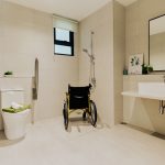 The bathroom in Type A1 is designed for accessibility and convenience, featuring a spacious layout, support rails, and wheelchai
