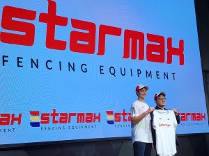 Malaysian foil fencer, Saif Nordin (left), receiving a jersey from Mr Yap Yew Kong, Advisor to Starmax Fencing. | Kuala Lumpur, Malaysia. 8 January 2025. | Photo by News Hub Asia