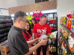 YB Datuk Phoong Jin Zhe, Minister of Industrial Development and Entrepreneurship Sabah (left), with Khazalin Ghuzal and Charles Brewer of Pos Malaysia at the launch of the Pos Shop in Kota Kinabalu, Sabah on 7 February 2025. | Photo by Pos Malaysia / NHA File Photo