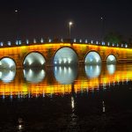 A bridge lit over water in Wuxi China