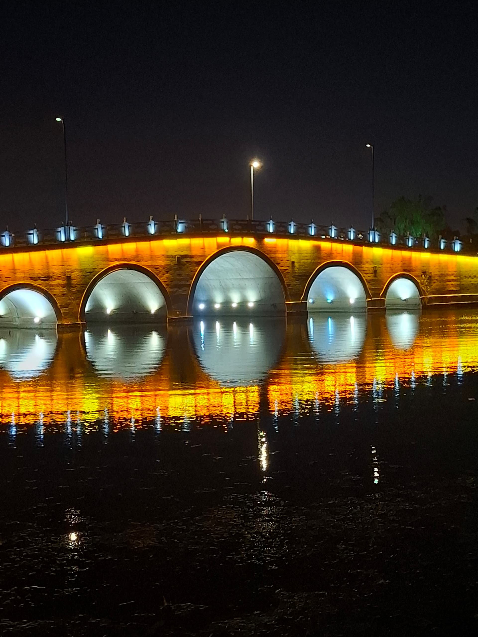 A bridge lit over water in Wuxi, China. | Photo by Saif Nordin / News Hub Asia
