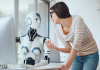A conceptual photo of an AI humanoid working with a human being at the office. Photo for illustrative purposes only. | Photo by demaerre / Getty Images Signature via Canva Pro / NHA File Photo