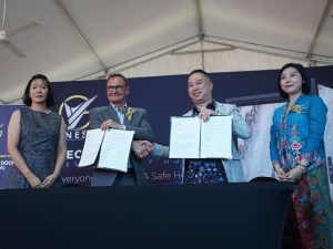 MoU signing between NES and Skinrock AG. From left: Ms. Tong, Skinrock AG; Ueli Stiffler, Skinrock AG; Datuk Sri Dom Tee, NES Security Door; and Kate Ng, NES Security Door. | NES Security Door’s factory, Klang, Malaysia. 17 May 2025 | Photo by NES / NHA File Photo
