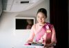 A Thai Airways flight attendant serving a 'Streets to Sky' inflight meal. | Photo by Dusit Foods and Thai Airways / NHA File Photo