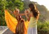 A tourist photographing a traditional dancer in Indonesia. | Photo by Pinnacle Pictures / Photo Images (via Canva Pro) / NHA File Photo
