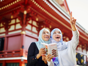 Women enjoying a guided tour in Japan. | Photo by Aflo Images from アフロ（Aflo) (via Canva Pro) / NHA File Photo