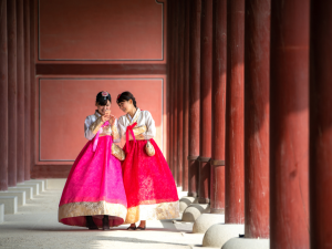 Tourists in the Korean traditional dress or "hanbok" exploring one of the Five Grand Palaces in Seoul, Korea. 5 November 2017. | Photo by NeoPhoto / Getty Images Pro (via Canva Pro) / NHA File Photo