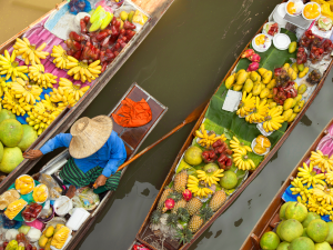 At the floating market in Thailand. | Photo by izzetugutmen / Getty Images (via Canva Pro) / NHA File Photo