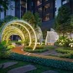 A scenic jogging path surrounded by greenery and softly lit arches, inviting quiet walks, morning runs, and mo