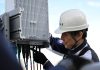An Ericsson engineer in Japan works on network equipment. | Photo by Ericsson / NHA File Photo