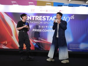 Local designer Angus Tsui (left) and artist/emcee Thor Lok (right) showcase a fashion piece designed by Angus Tsui. | Hong Kong, 18 August 2025 | Photo by CENTRESTAGE / NHA File Photo
