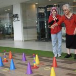Residents participating in interactive activities at the games booth