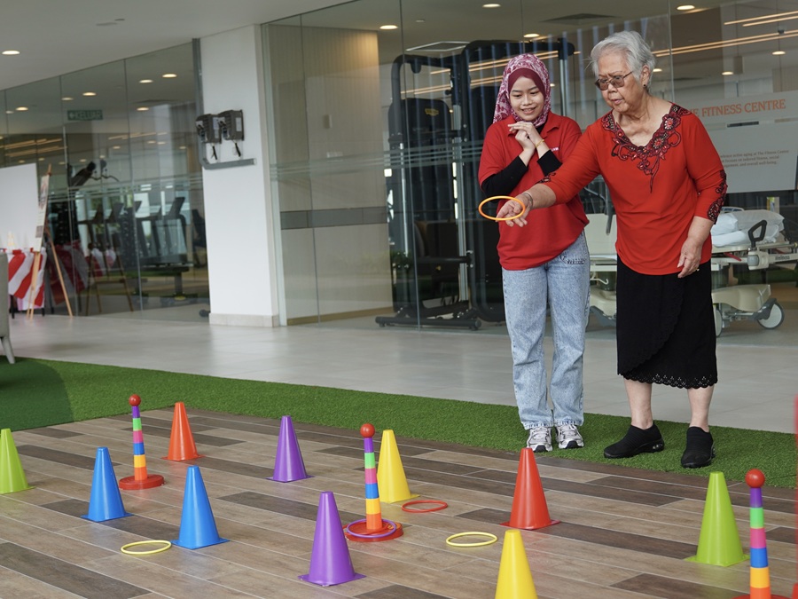 Residents participating in interactive activities at the games booth. | Photo by Sunway Sanctuary - October 2025 / NHA File Photo