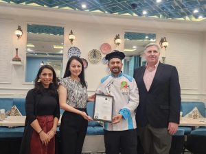Turkish Cafe Istanbul's founder and chef, Deniz Alkoç (second from right), receiving the NHA Top 10 Award as one of the Best Middle Eastern Restaurants in Malaysia from NHA co-founder, Somaya Ong (second from left). Also in the photo are NHA co-founder, Nordin Abdullah (rightmost), and Ruzanna Muhammad, NHA's editor-at-large (leftmost). | Kuala Lumpur, Malaysia. 25 October 2025 | Photo by News Hub Asia