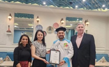 Turkish Cafe Istanbul's founder and chef, Deniz Alkoç (second from right), receiving the NHA Top 10 Award as one of the Best Middle Eastern Restaurants in Malaysia from NHA co-founder, Somaya Ong (second from left). Also in the photo are NHA co-founder, Nordin Abdullah (rightmost), and Ruzanna Muhammad, NHA's editor-at-large (leftmost). | Kuala Lumpur, Malaysia. 25 October 2025 | Photo by News Hub Asia