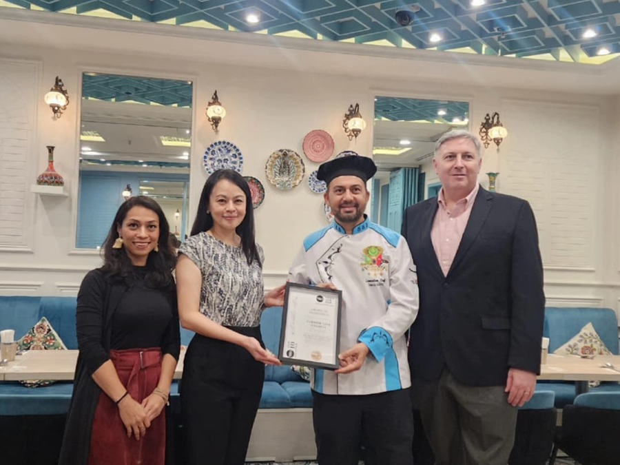 Turkish Cafe Istanbul's founder and chef, Deniz Alkoç (second from right), receiving the NHA Top 10 Award as one of the Best Middle Eastern Restaurants in Malaysia from NHA co-founder, Somaya Ong (second from left). Also in the photo are NHA co-founder, Nordin Abdullah (rightmost), and Ruzanna Muhammad, NHA's editor-at-large (leftmost). | Kuala Lumpur, Malaysia. 25 October 2025 | Photo by News Hub Asia