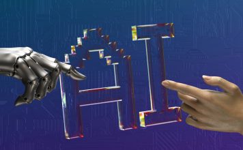 The letters AI for artificial intelligence in between a robot's hand and human hand, pointing at each other. Photo for illustrative purposes only. | Photo by Igor Omilaev / Unsplash / NHA File Photo