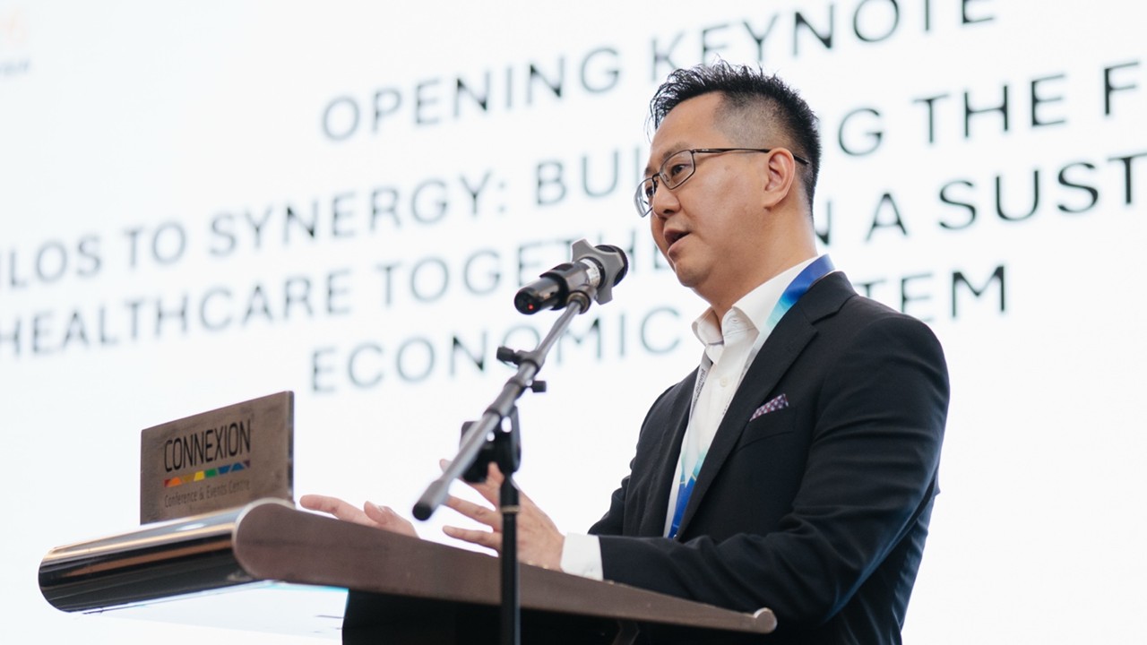 Mr. Kenny Tai, Chief Executive Officer of MediExpress and Health Connect Sdn Bhd, delivering the opening keynote on “Silos to Synergy: Building the Future of Healthcare Together in a Sustainable Economic System,” setting the stage for collaborative discussions and innovative ideas shaping Malaysia’s healthcare landscape. Press Release – IMPACT Summit 2026